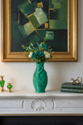 Emerald Green 3D-printed elegant swan vase with embossed vines and leaves holding colorful flowers on a mantel.