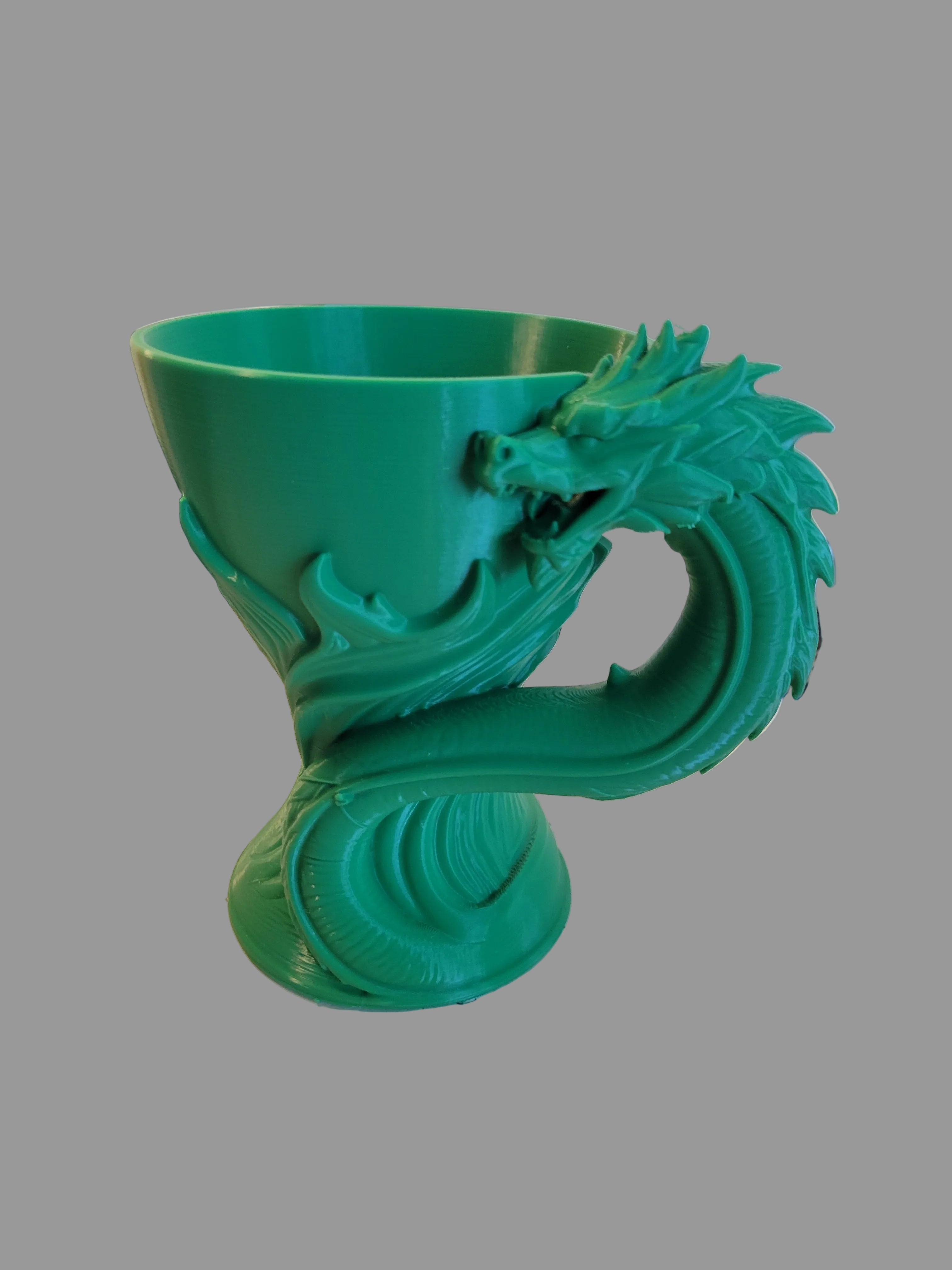 Emerald Green 3D-printed sculptural dragon goblet with a dragon head handle isolated against a light gray background.