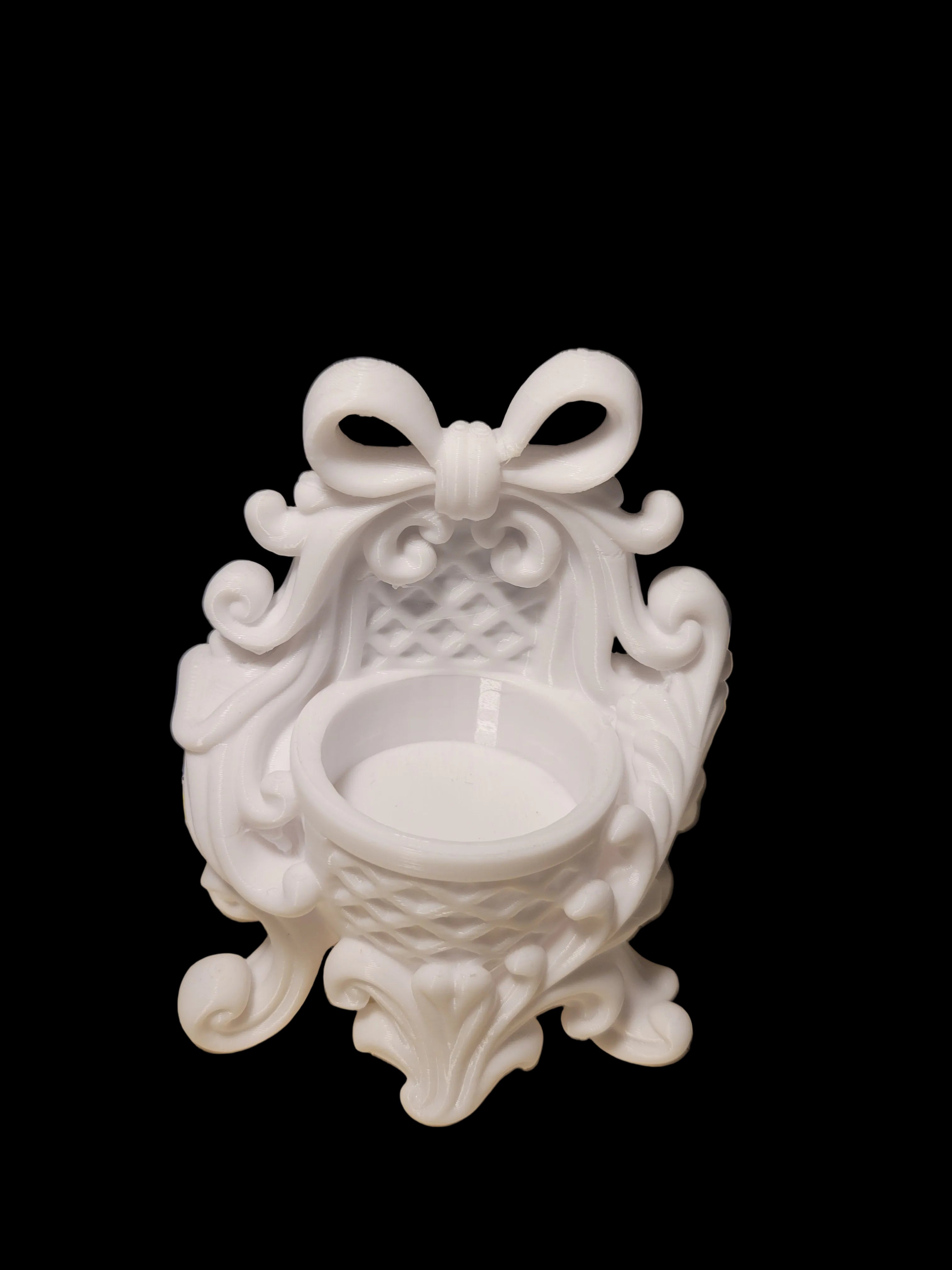 Arctic White 3D-printed tea light candle holder in an ornate Victorian style designed for 1 candle on a black background.
