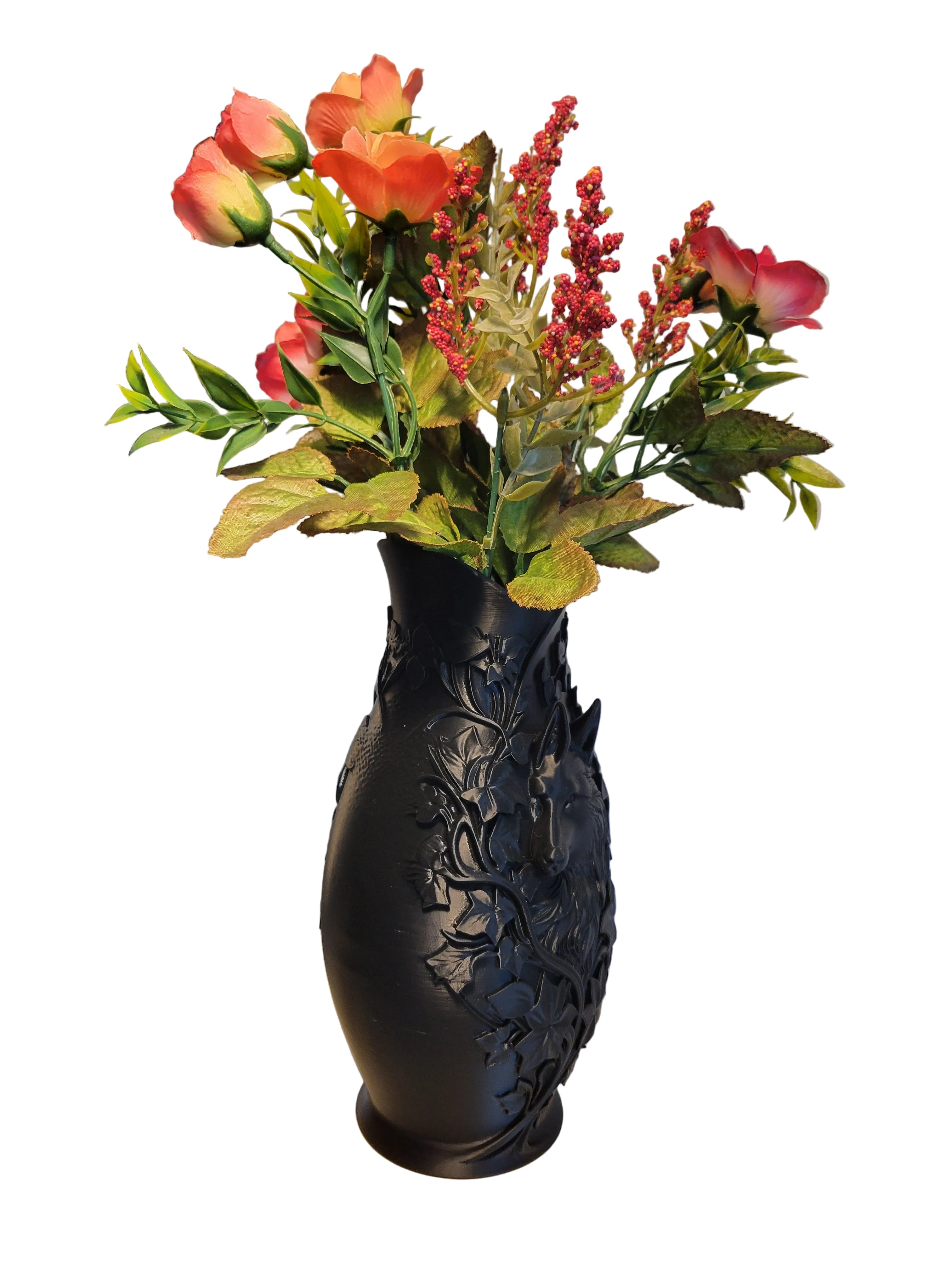 Onyx Black 3D-printed wolf vase with intricate floral design in an angled view holding orange flowers on a white background.