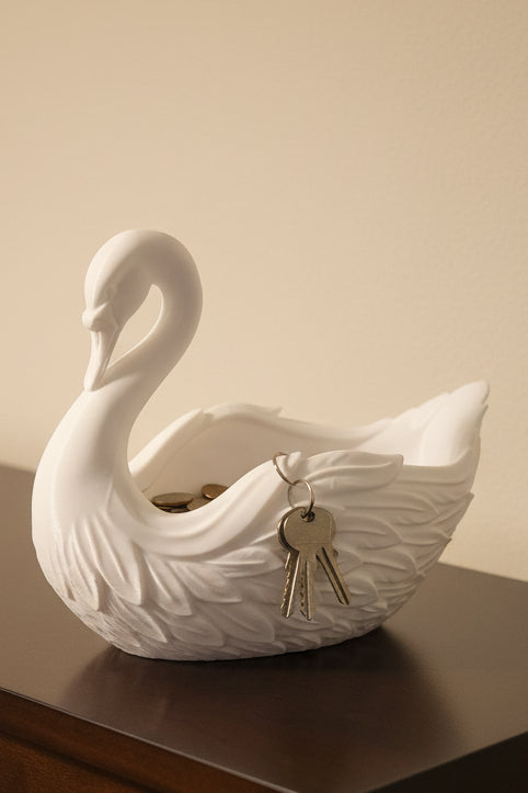 Arctic White 3D-printed catch-all tray beautifully feathered detailing of an elegant swan holding change and keys on a wood table.