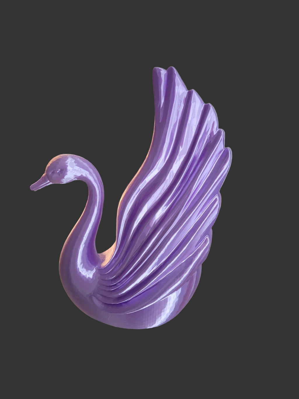 Purple Silk 3D-printed elegant swan statue with a modern wing design on a solid gray background.