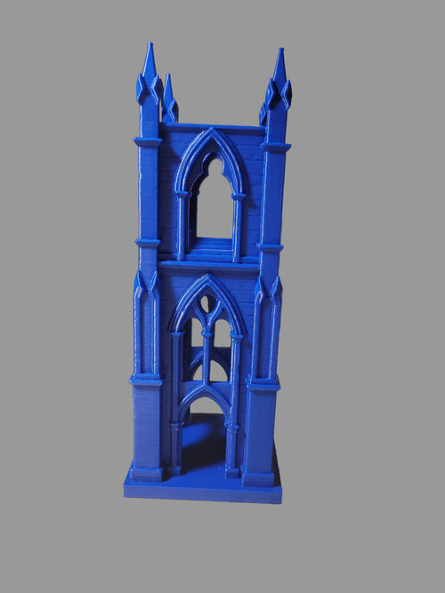 Cobalt Blue 3D-printed tea light holder with gothic style arched windows and 4 pillar cathedral construction on a light grey background.