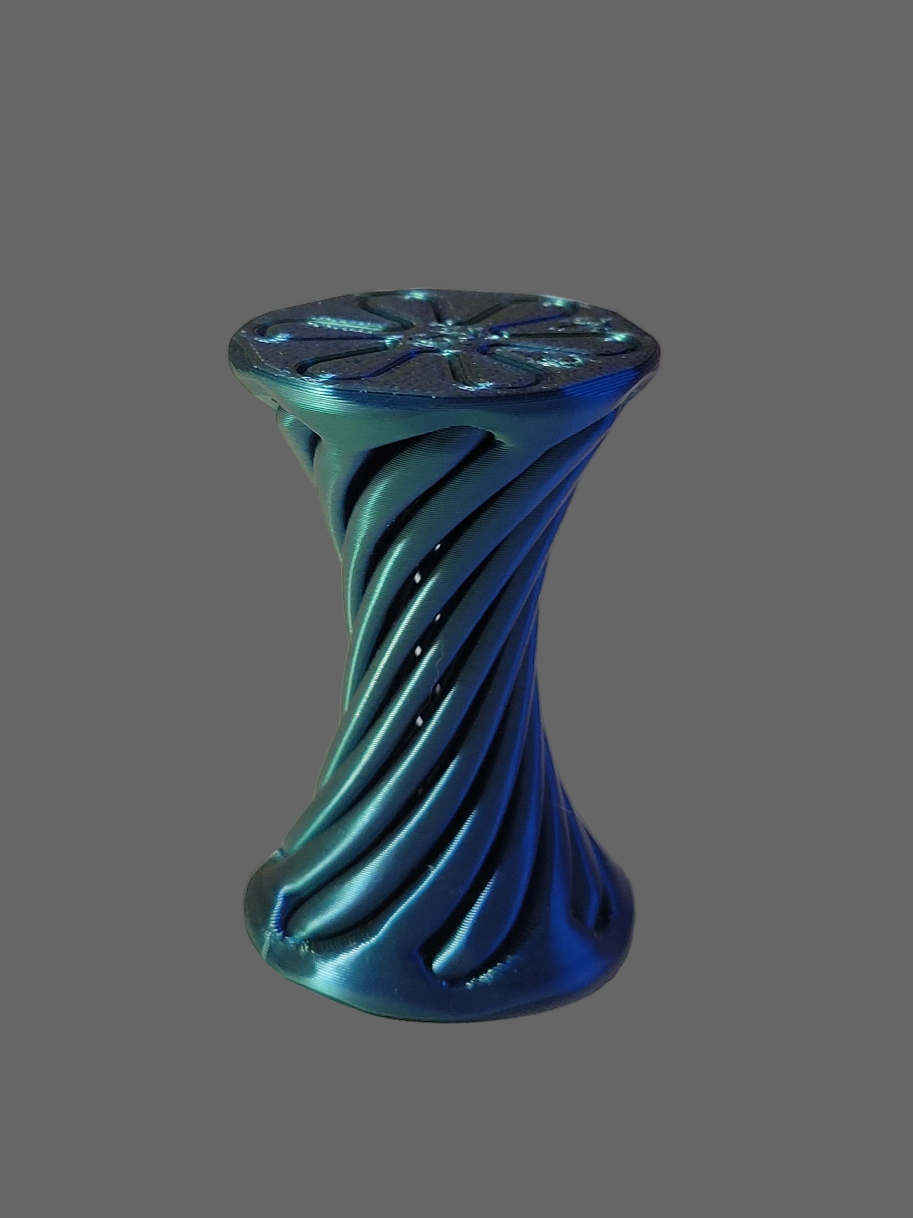Blue to Green Silk color-shifting 3D-printed hourglass twisting fidget that interlocks in both directions displayed on a grey background.