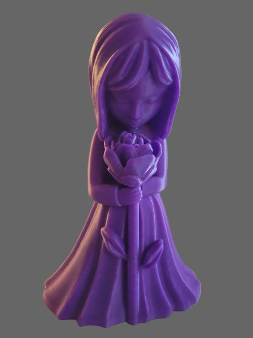 Royal Purple 3D-printed figurine of a girl in a flowing dress looking at a blooming flower on a gray background. 
