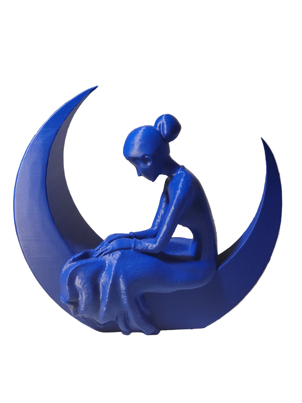 Cobalt Blue 3D-printed sculpture of a serene woman in a gown sitting in a crescent moon on a white background.